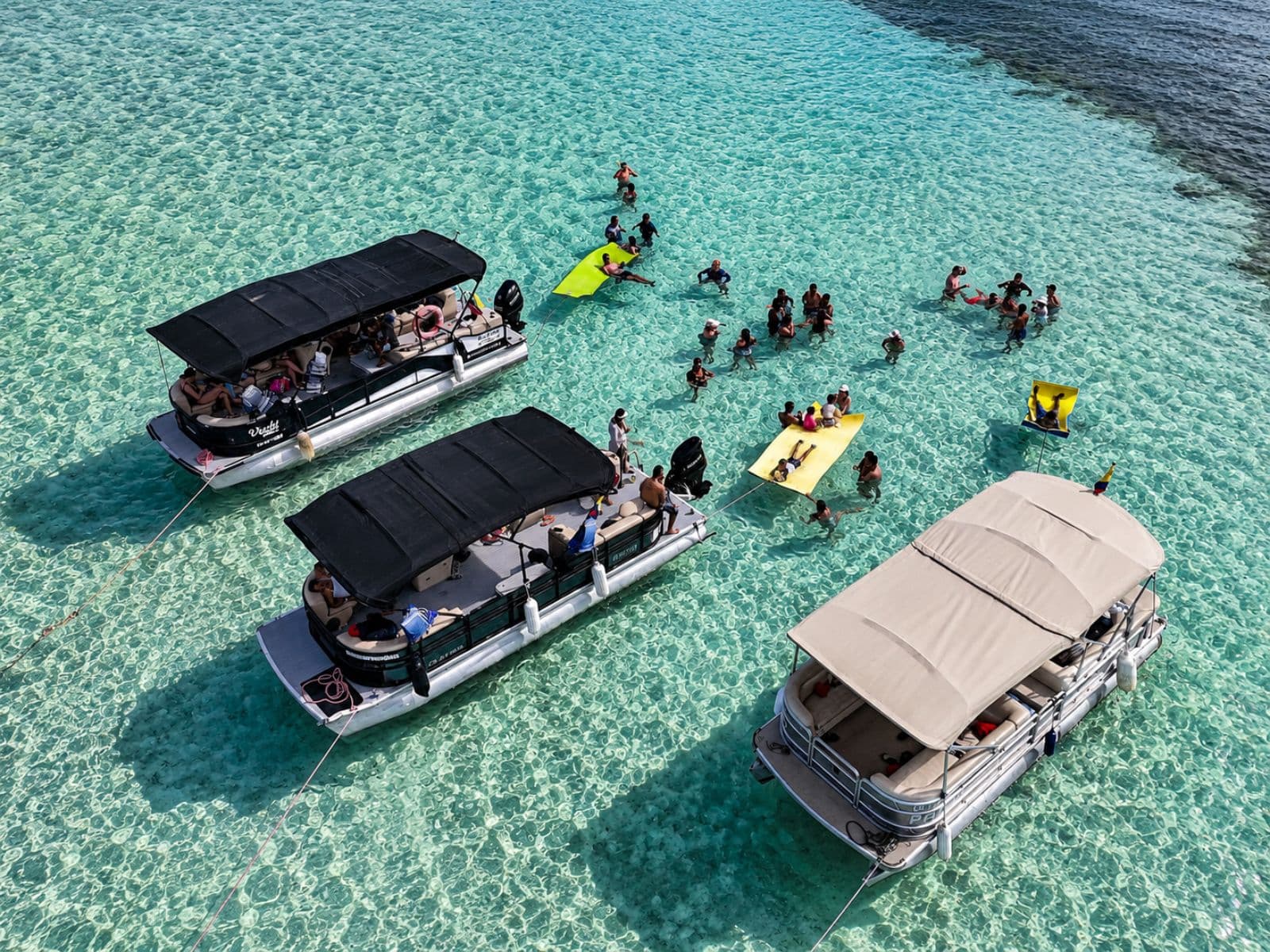Aerial view of pontoons on shallow, crystal-clear water